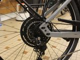 a close up of a bicycle with a chain on the front wheel