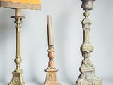 three candles that are sitting next to each other on a table