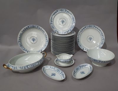 a lot of plates and bowls sitting on a table