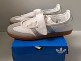 a pair of shoes that are on top of a box
