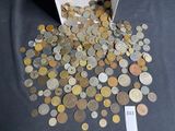 a box full of coins sitting on a table with a price tag