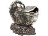 a silver shell with a bird on top of it