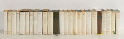 a lot of books that are sitting on a table