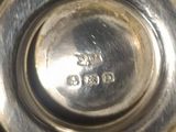 a close up of a silver plate on a table