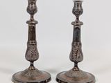 pair of antique silver candlesticks with floral decoration
