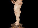 an image of a statue of a child on a pedestal