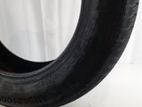 a close up of a tire on a white surface with a white background