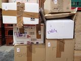 many boxes stacked on top of each other in a room