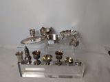 a display of silverware on a clear shelf