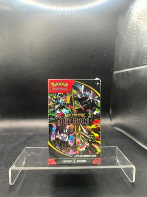 a close up of a box of pokemon cards on a table