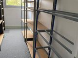 a room with a lot of shelvings in it