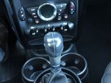 a close up of a car ' s interior with a steering control