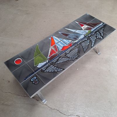 a bench made out of glass with sailboats painted on it
