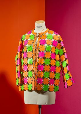 an orange and green jacket on a mannequin mannequin mannequin mannequin mannequin mannequin mannequin mannequin mann