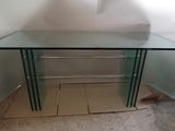 a glass table with a glass top on a hard wood floor