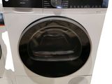 a washing machine and a dryer sitting next to each other