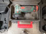 an image of a cordless drill in a case with tools in it