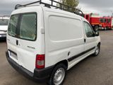 a white van that is parked in a parking lot