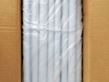 a cardboard box with a bunch of white straws in it