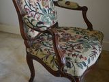 a chair that is sitting in the corner of a room