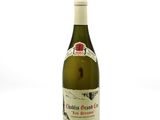 a bottle of wine that is sitting on a table