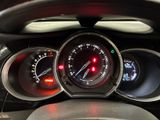 a close up of a car dashboard with various gauges