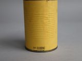 yellow tin of food sitting on top of a white surface