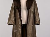an image of a brown leather coat with a fur collar on a mannequin