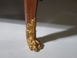 a close up view of the legs of a wooden table