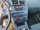 a dashboard of a car with a radio and a steering wheel