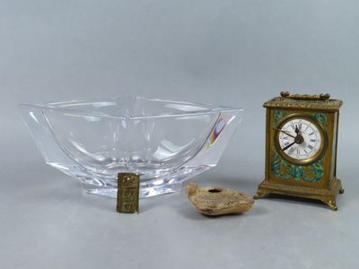 a small glass bowl with a clock on the side