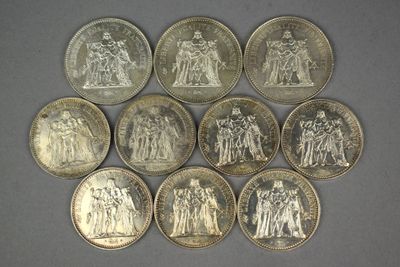 a close up of a bunch of coins on a table