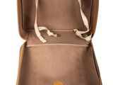 the inside of a brown suitcase with a handle and strap