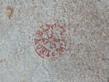 a red circle on the sidewalk of a sidewalk
