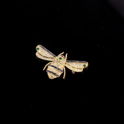 Broche en or 18k (750e), stylisant une abeille pavée de diam… - Photo 1