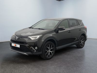 a grey toyota rav parked in a garage