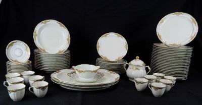 a lot of plates and cups on a black table