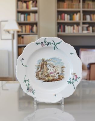 a white plate with a picture of a man and a woman on it