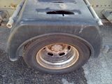 a close up of a flat tire on a truck
