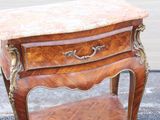 a small table with a marble top on it