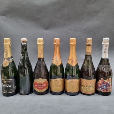 a group of six bottles of champagne sitting next to each other