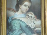 tableau représentant une femme tenant un chien dans ses bras
