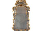 une image représentant un miroir bleu et doré sur fond blanc