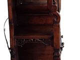 a tall wooden cabinet with a clock on top of it