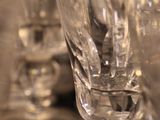 several empty wine glasses sitting on top of a wooden table