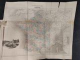 an old map of france on a piece of paper on a table