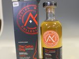 an image of a bottle of whisky next to a box of wine