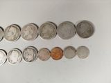 a lot of coins that are on the table