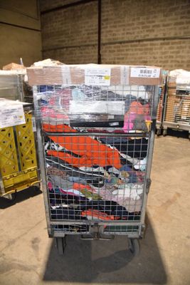 many boxes of clothing on a cart in a warehouse