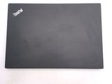 a laptop that is sitting on a white surface